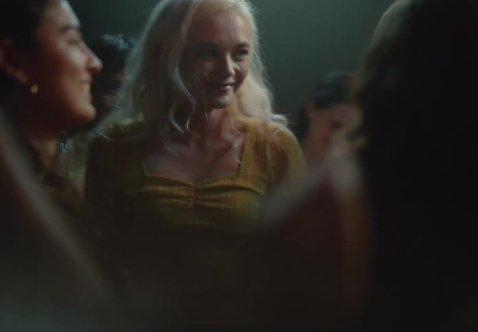 Blonde woman dancing in a club having a great time