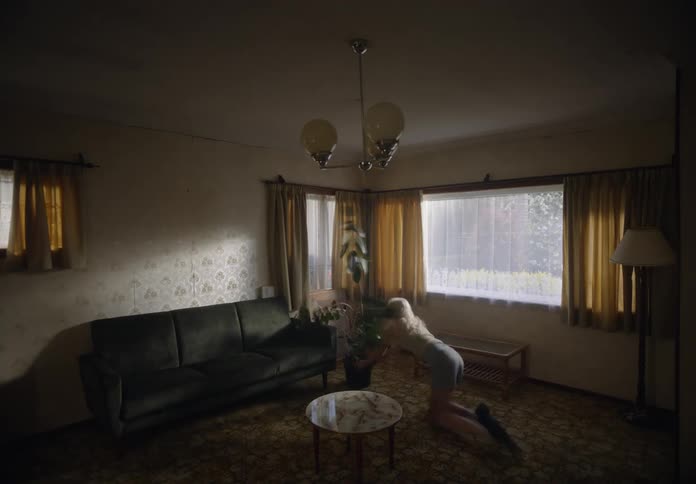 Couple arranging furniture in a living room