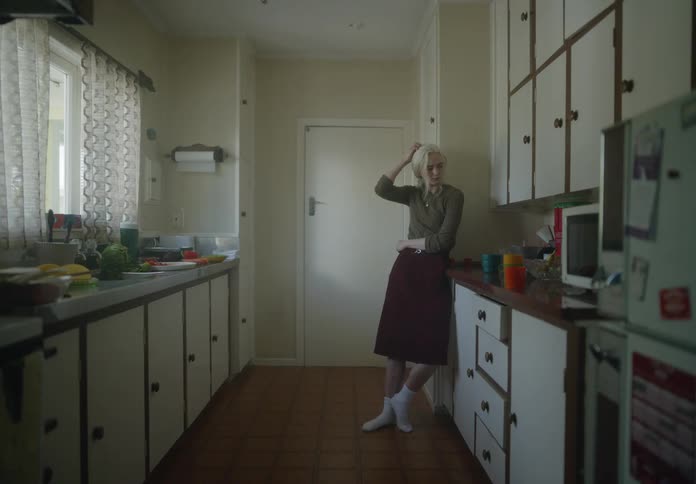 Sad woman cooking in the kitchen