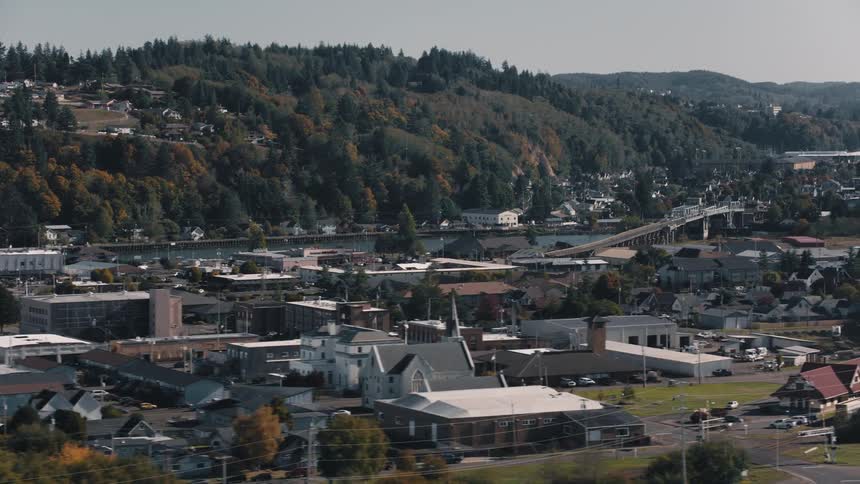 Aerial view of a residential neighborhood with hills in the background