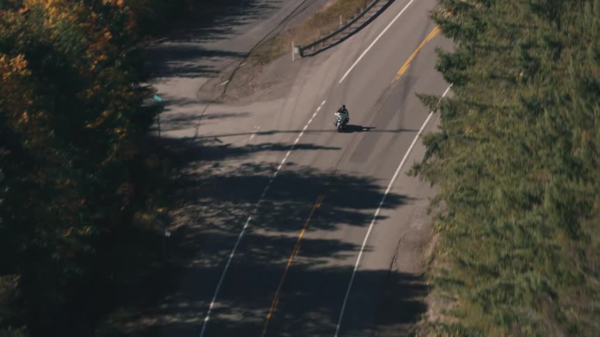 Person on a motorcycle traveling on a highway