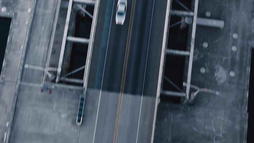 Aerial view of a bridge above the sea and with vehicle traffic during the day
