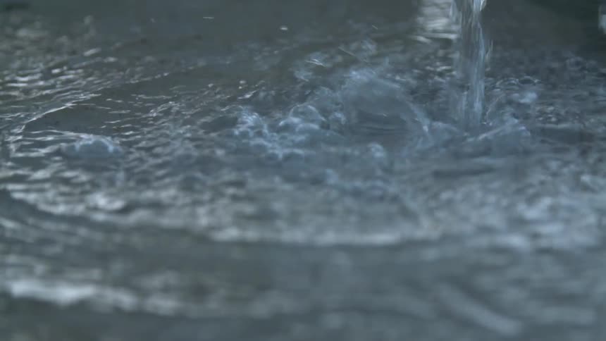 Water pouring into a body of water