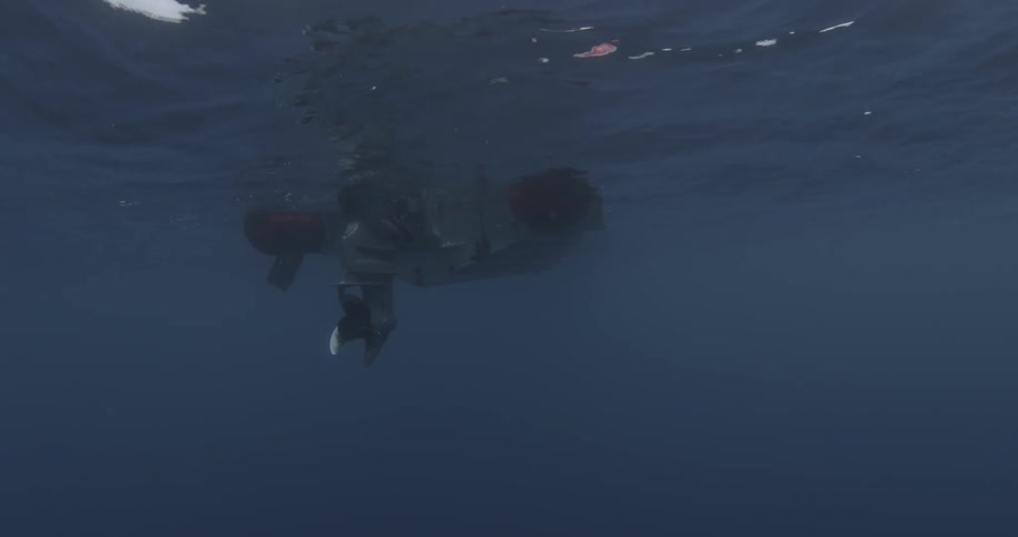A boat is being filmed from under water