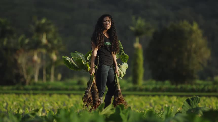 A clip of a farmer holding some harvests