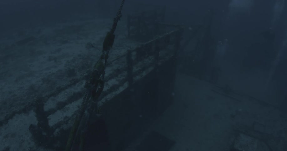 Bubbles float near ship wreckage in the ocean