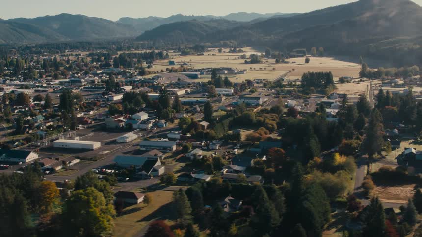 A small town sits by the mountains