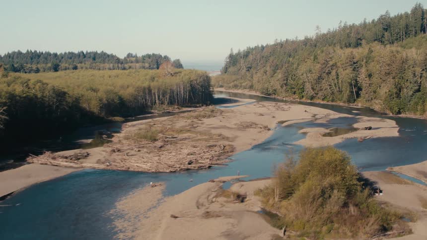 A small stream runs through the forested areas