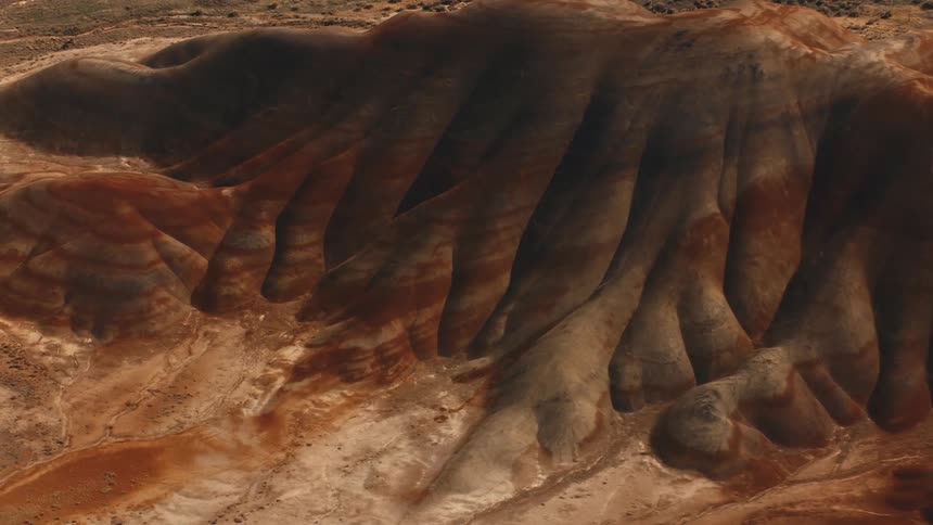 An aerial clip of a hill in the desert
