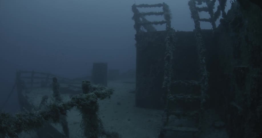 Ship wreckage is shown on the ocean floor