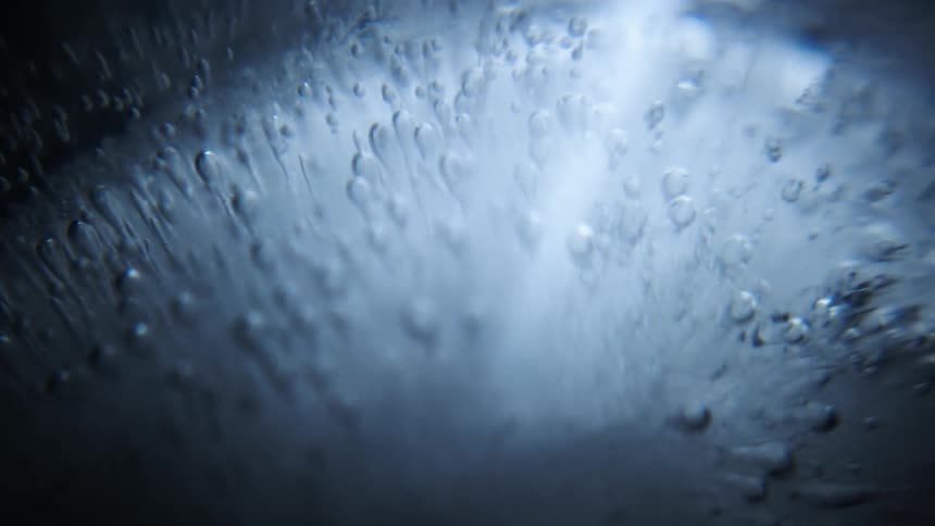 Closeup of spinning ice with light reflection