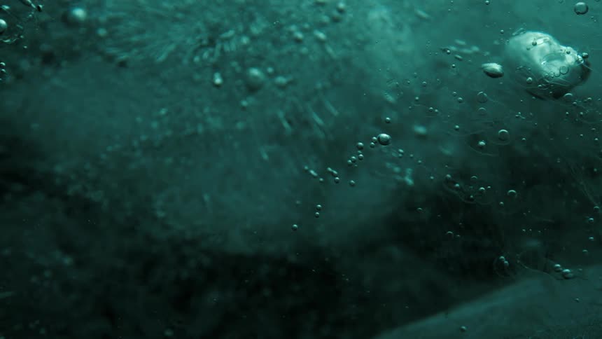The ice slowly turns in the dark