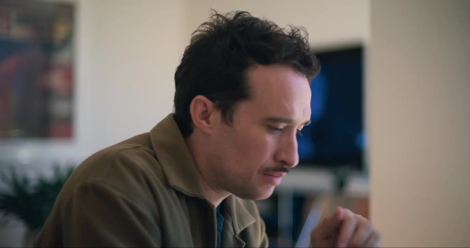 A footage of a man typing on a laptop
