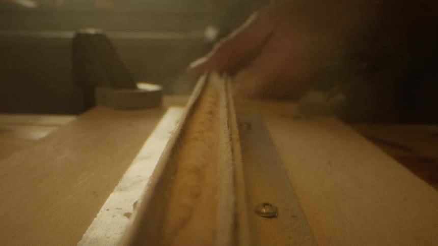 Hand holding an object and molding it on a powdered surface