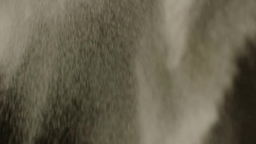 Fine powder fills the air with dust while falling