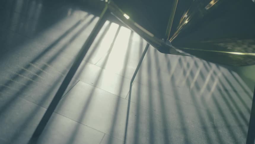 Modern metallic chair in an indoor space with solar reflection