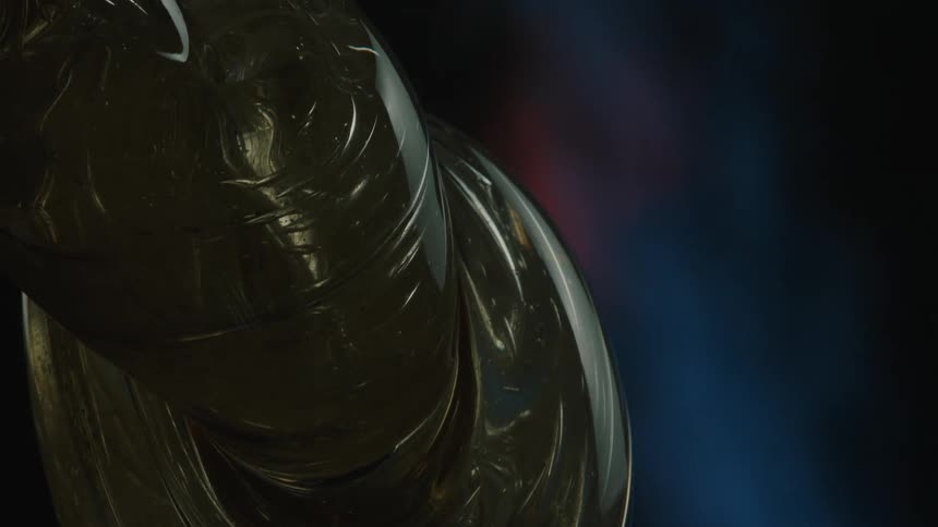 A close up of a piece of glass next to an open blue flame