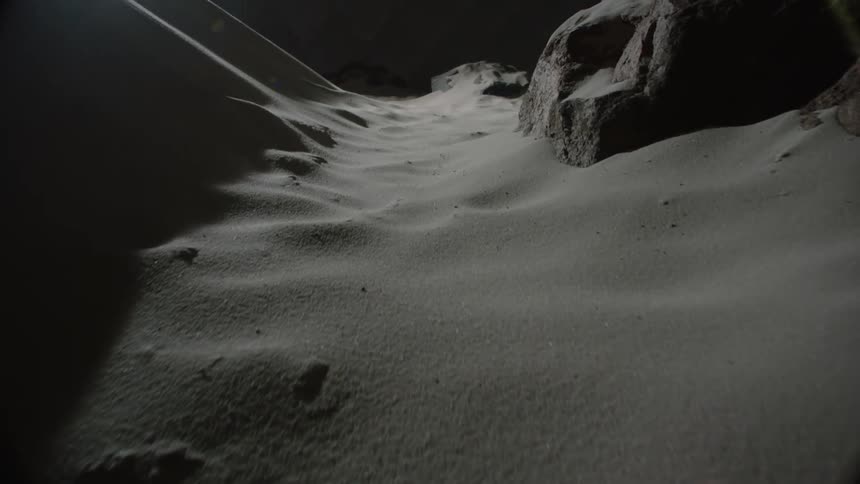 Miniature landscape representing a desert with sand dunes and rocky outcrops