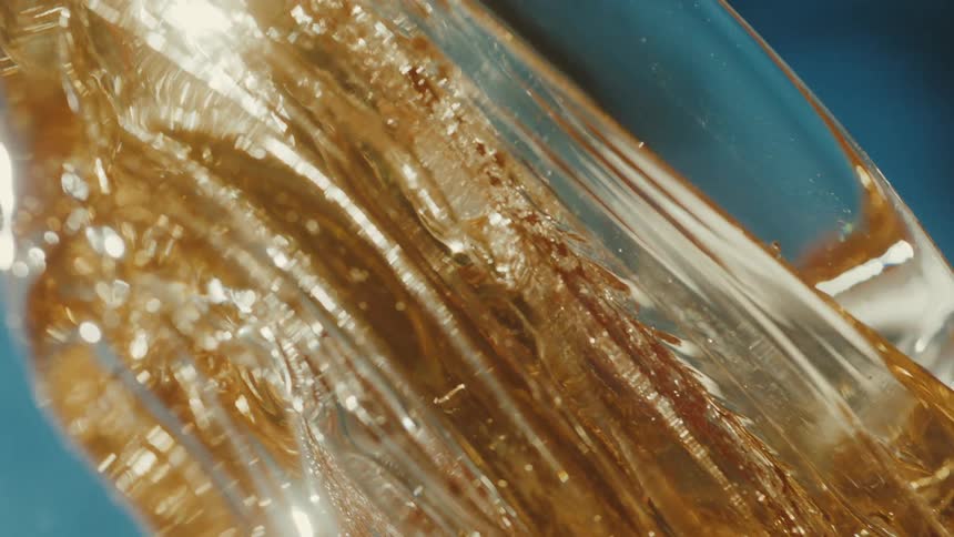 The glass is being heated and sculpted