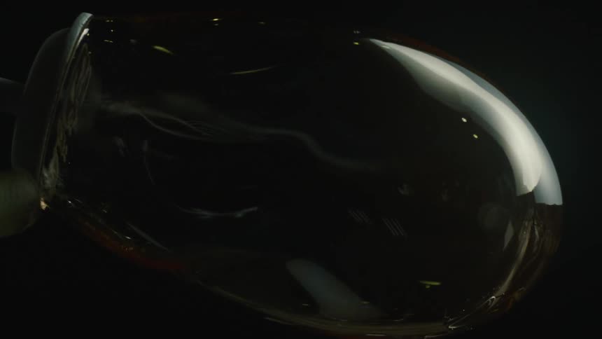 The glass is hardening and cooling as it spins