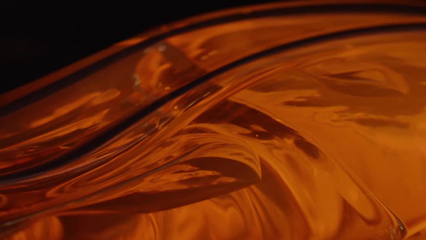 Close up of glass being shaped by fire
