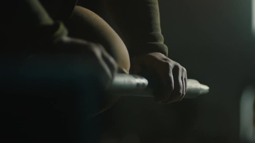A person is spinning a rod in place