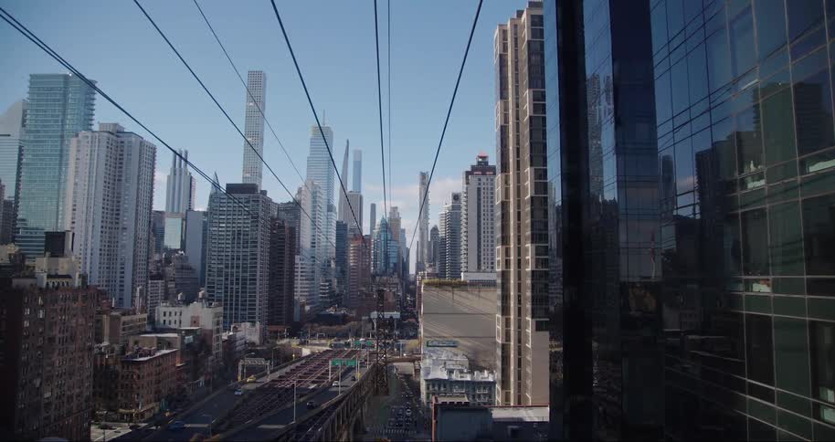 Cable car in the middle of a metropolis with skyscrapers