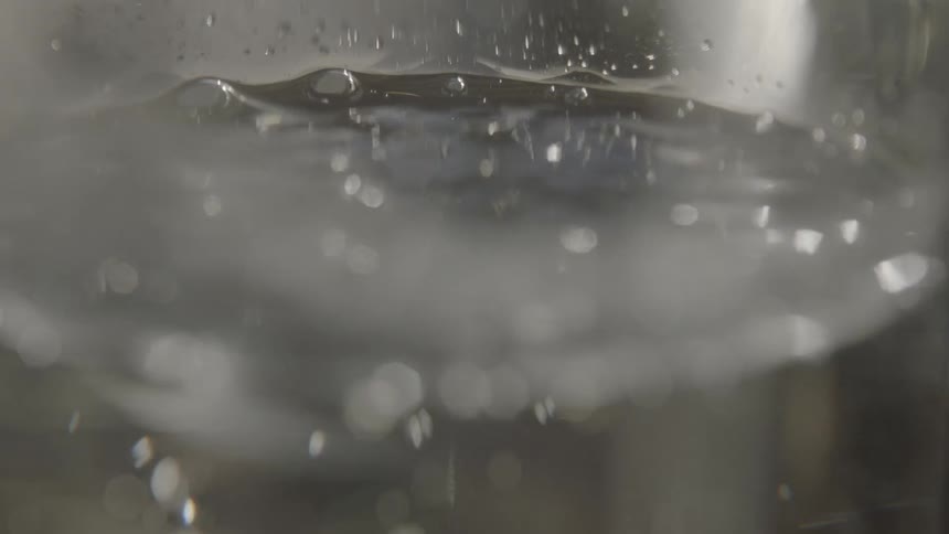 Bubbles rise as the water boils
