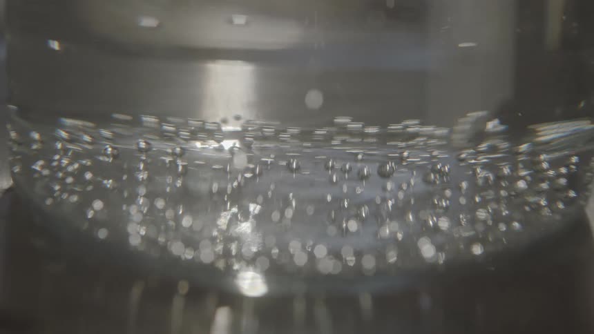 Bubbles rise in the container