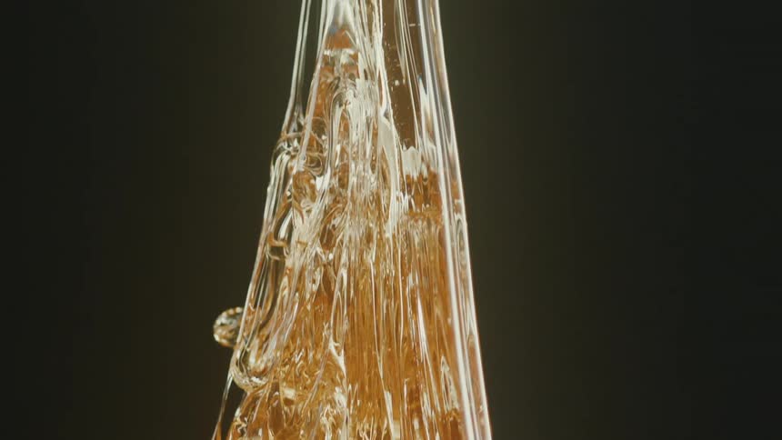 Closeup of a goldenhued mass of molten glass