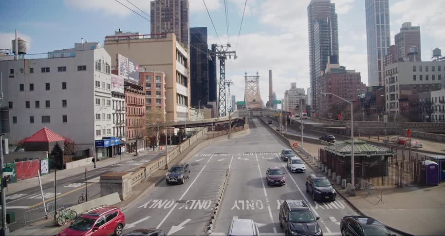 Traffic moves out into the intersection in the city
