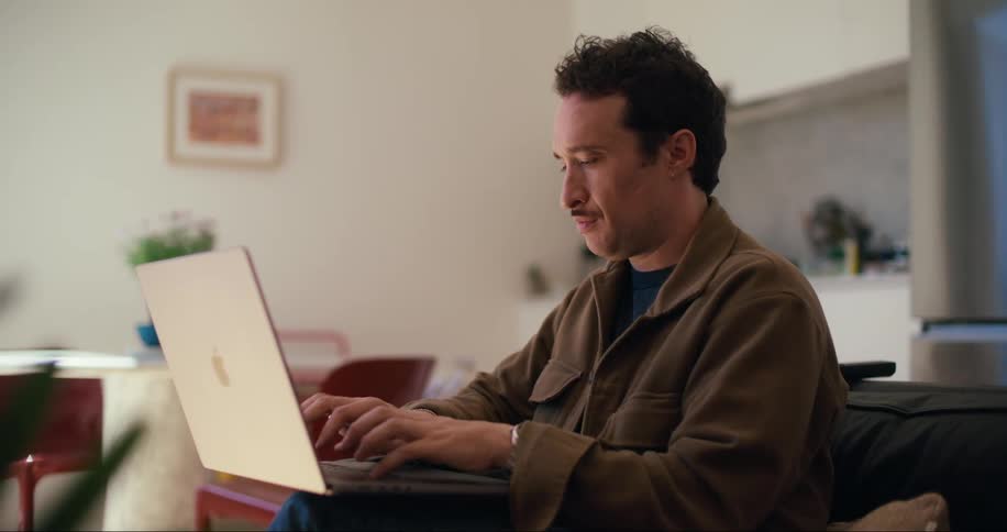 Man working from home typing on his laptop