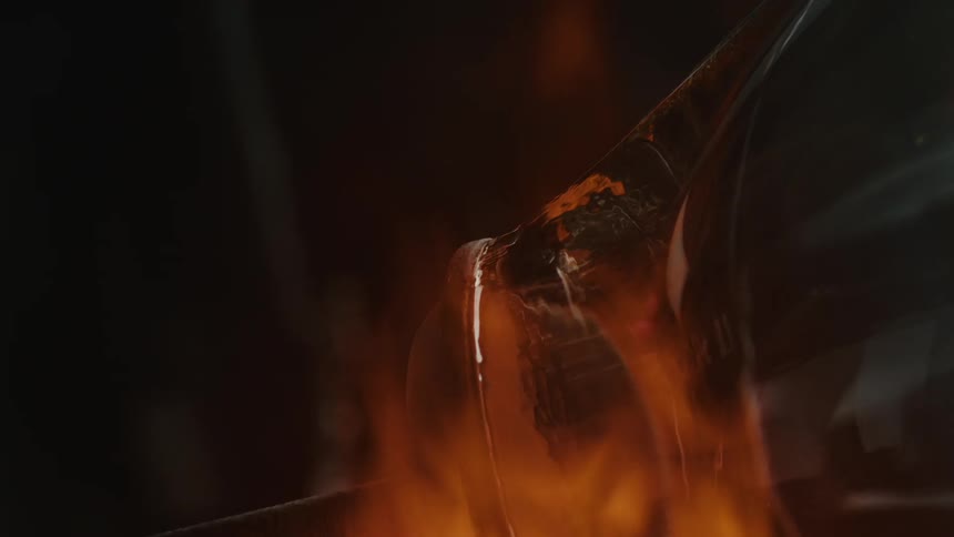 Close up of fire shaping glass
