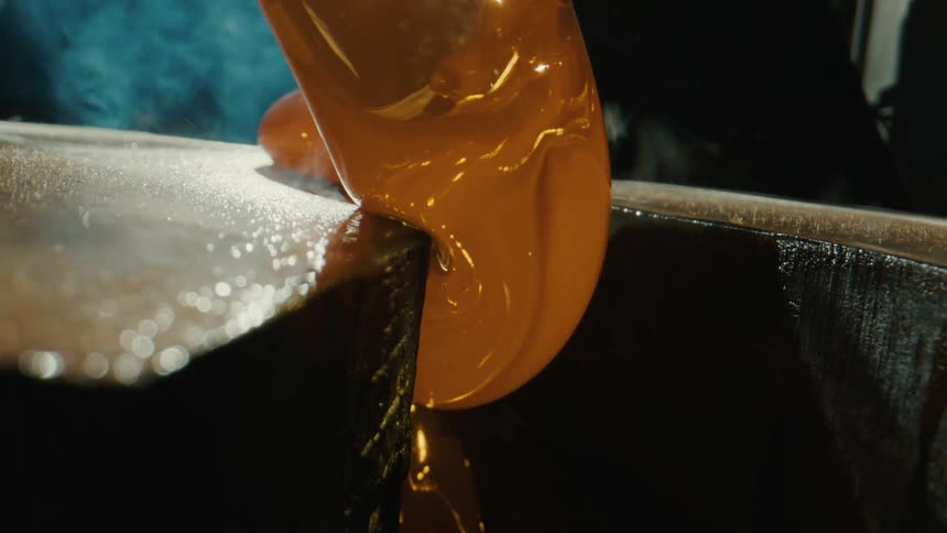Heated glass being poured onto a surface