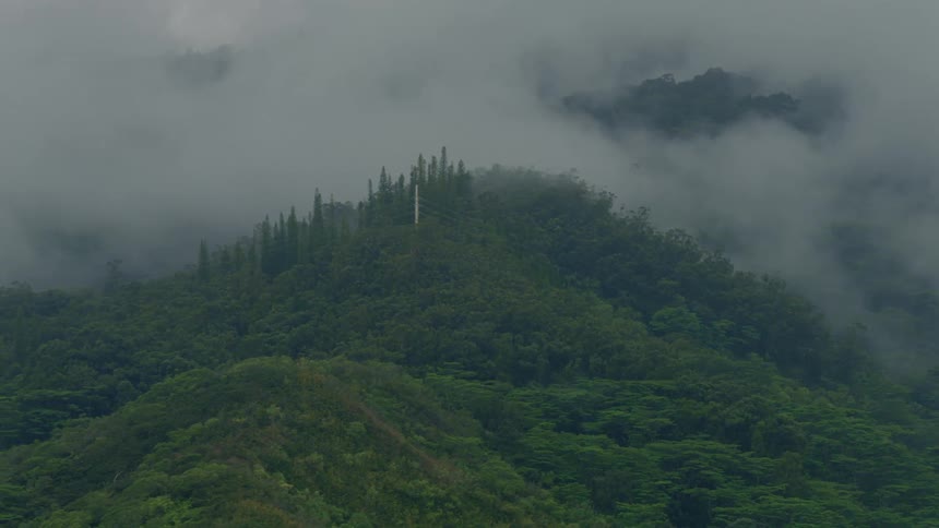 An aerial clip of a foggy mountain