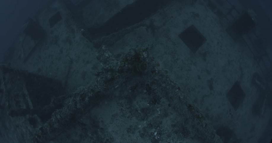 Ship wreckage lays on the ocean floor