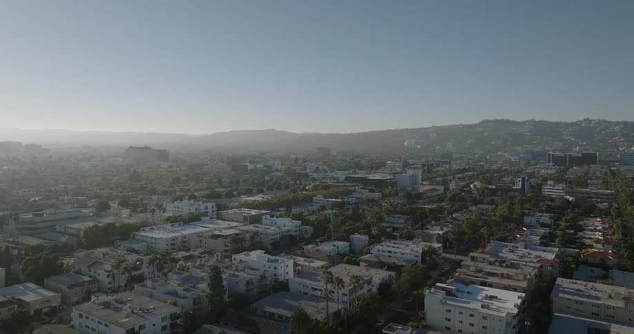 Aerial panorama of an urban city with mountains in the background