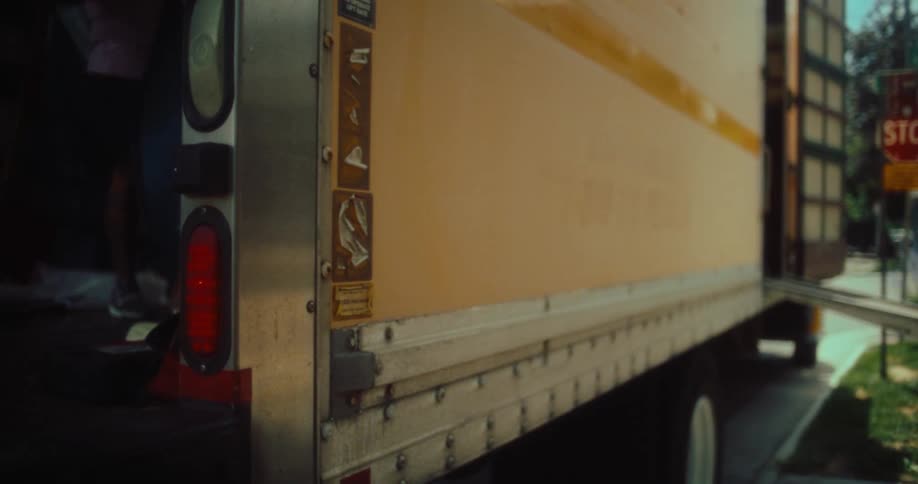 A man is moving inside the large moving truck