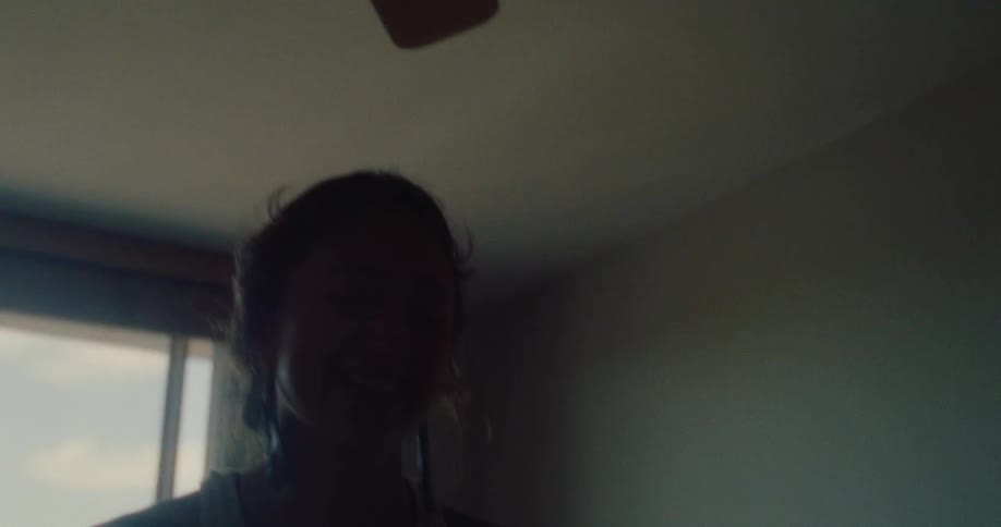 A footage of a lady in the room