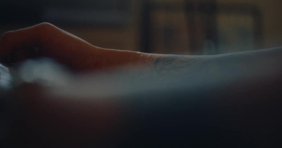 Close up of a persons tattooed arms