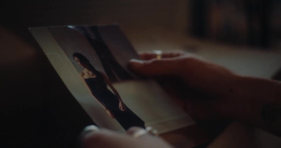 Pair of hands holding a photograph