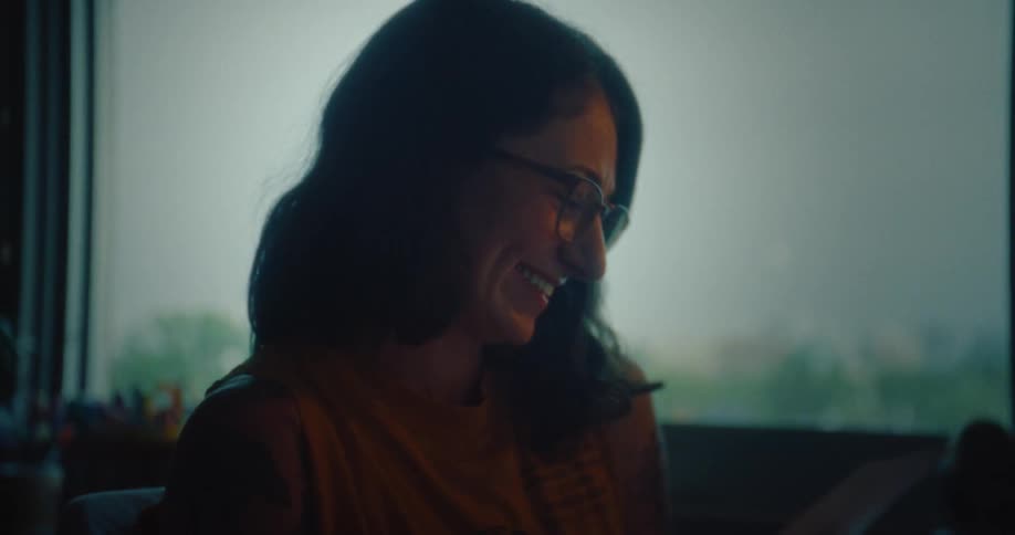 A woman talks and laughs