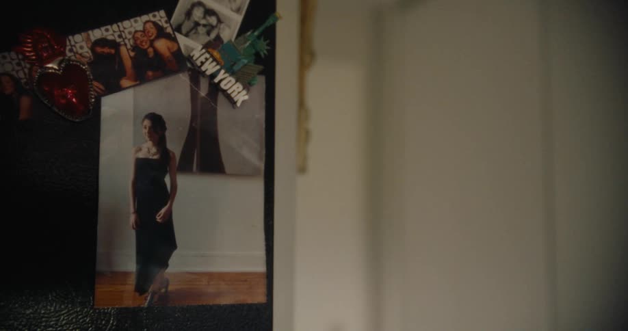 Photograph of a woman glued to a mirror