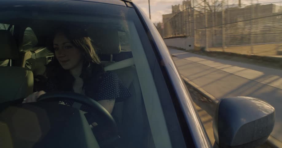 Woman driving a vehicle during the day