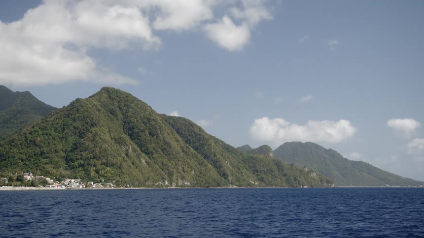 Mountains at the edge of blue water