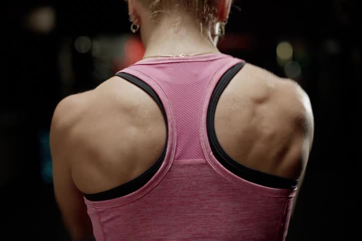 A back clip of a lady working out