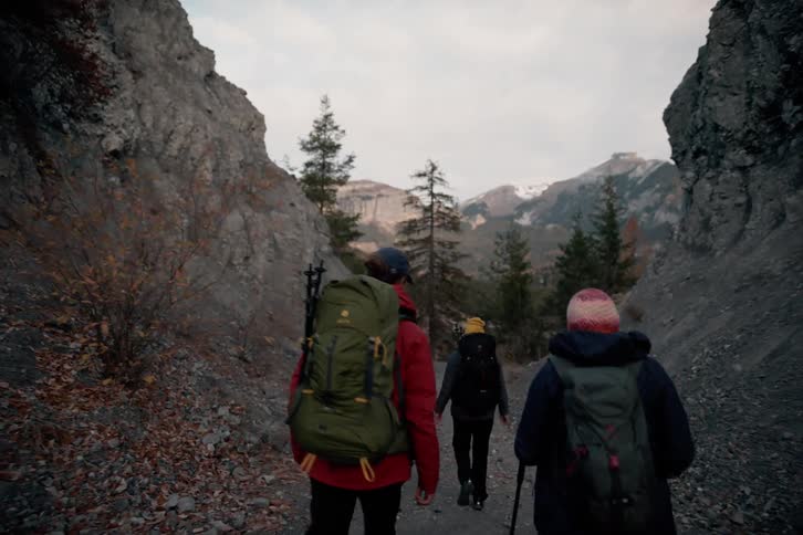 Group of friends hiking on a path through the canyons