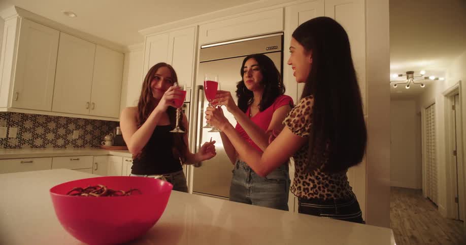 Women having a drink and celebrating together