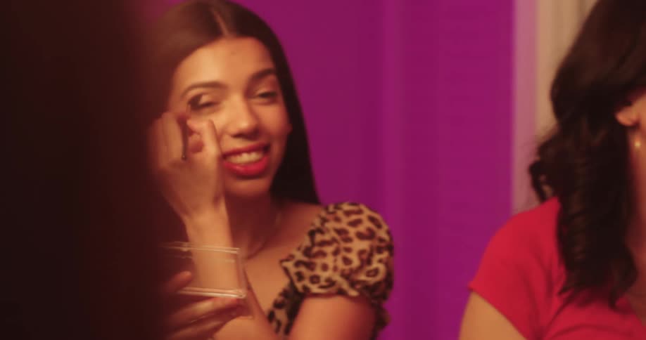 Teenage girls having fun dancing while putting on makeup in the bathroom at home