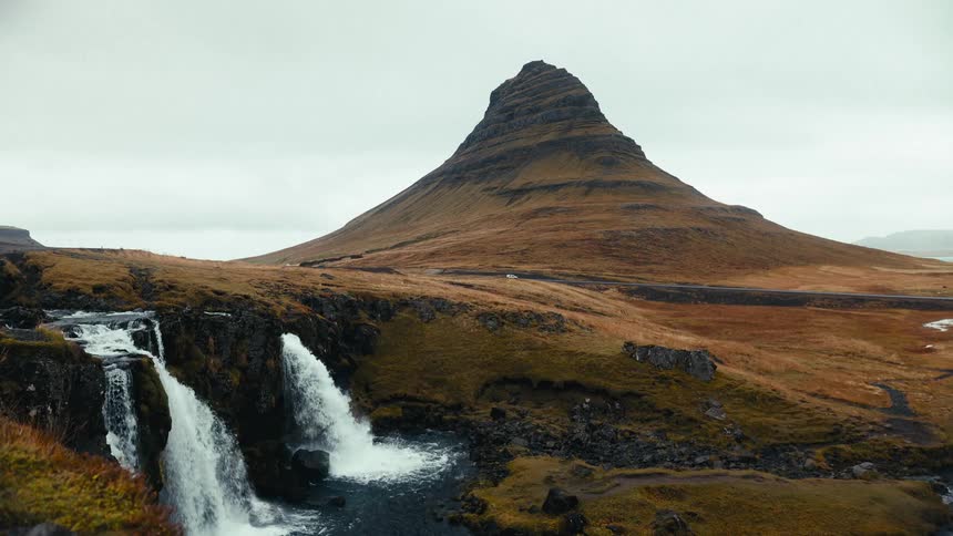 Waterfalls near a mountain